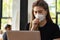 Business Asian young woman working with computer laptop and wearing protection mask coughing be congested with virus infection