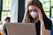 Business Asian young woman working with computer laptop and wearing protection mask coughing have fever and illness