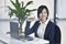 Business Attractive young woman smiling at desk