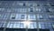 Business building windows reflecting blue sky and clouds