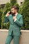 Business call. Stylish guy wear tuxedo. Stay connected. Businessman talk mobile phone. Handsome bearded man with cell