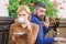 Business call white dating. First meet of girl and mature man. Brutal bearded hipster and girl drink coffee. Couple in