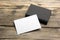 Business card blank on wooden background. Corporate Stationery, Branding Mock-up. Creative designer desk. Flat lay. Copy