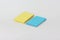 Business card, yellow and blue on a white background.