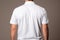 Business casual mens white polo shirt from behind, exuding relaxed professional elegance