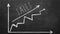 Business chart on blackboard showing increase in sales