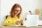 Business chat. Woman texting via smartphone, working on laptop