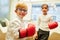 Business children as businessmen during boxing training