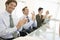 Business Colleagues Applauding In Conference Room