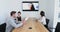 Business colleagues attending a video call in conference room 4k