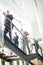 Business Colleagues Climbing Stairs In Modern Office