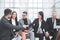 Business colleagues greet each other in the conference room.