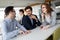 Business colleagues having conversation during coffee break