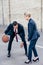 Business colleagues playing basketball