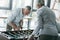 Business colleagues playing foosball at office