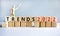 Business concept of 2022 trends symbol. Words `Trends 2022` on wooden cubes. Wooden model of businessman. Beautiful white