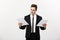 Business Concept: Attentive handsome businessman working comparing paper report. over white grey background.