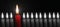 Business concept best idea red candle among other candles black