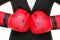 Business concept - boxing gloves and suit