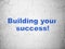 Business concept: Building your Success! on wall background