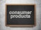 Business concept: Consumer Products on chalkboard background