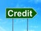 Business concept: Credit on road sign background