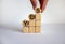 Business concept growth success process. Male hand. Wood blocks and circles with word `yes` stacking as step stair on white