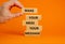 Business concept growth success process. Wood blocks on orange background, copy space. Businessman hand. Words `make your mess