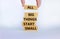 Business concept growth success process. Wood blocks on white background, copy space. Businessman hand. Words `all big things