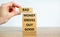 Business concept growth success process. Wood blocks on white background, copy space. Businessman hand. Words `bad money drives