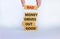 Business concept growth success process. Wood blocks on white background, copy space. Businessman hand. Words `bad money drives