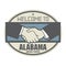 Business concept with handshake and the text Welcome to Alabama, United States