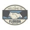 Business concept with handshake and the text Welcome to Florida, United States