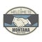 Business concept with handshake and the text Welcome to Montana, United States