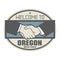 Business concept with handshake and the text Welcome to Oregon,