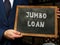 Business concept about JUMBO LOAN with sign on chalkboard in hand