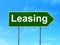 Business concept: Leasing on road sign background