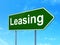 Business concept: Leasing on road sign background