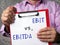 Business concept meaning Earnings Before Interest and Taxes EBIT vs. EBITDA Earnings Before Interest, Taxes, Depreciation and