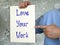 Business concept meaning Love Your Work with sign on the piece of paper