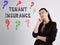 Business concept meaning TENANT INSURANCE question marks with phrase on the gray wall