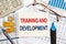 Business concept - notebook writing TRAINING AND DEVELOPMENT