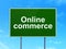Business concept: Online Commerce on road sign background