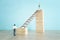 Business concept picture of challenge. A man stands on the edge of a high wall and passes the gap by placing a ladder. Problem