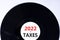 Business concept of planning 2022 taxes happy new year. Concept words Taxes 2022 on black vinyl disc. Beautiful white background,