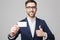 Business Concept - Portrait Handsome Business man showing name card with smiling confident face. White Background.Copy Space.