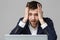 Business Concept - Portrait handsome stressful business man in suit shock looking at work in laptop. White Background.