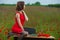 Business concept shot of a beautiful young woman sitting at a desk using a computer in a field.