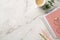 Business concept. Top view photo of workspace pink planners stylish glasses cup of coffee pens and eucalyptus on white marble