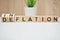 Business concept words inflation deflation on wooden blocks